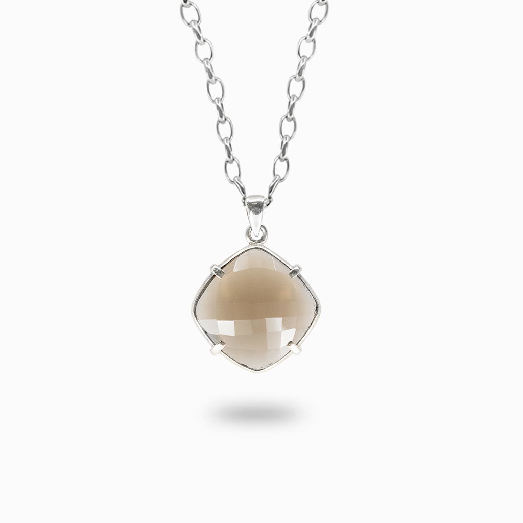 Faceted cushion-shaped Smoky Quartz pendant necklace with translucent taupe-brown coloring in a four-prong sterling silver setting.
