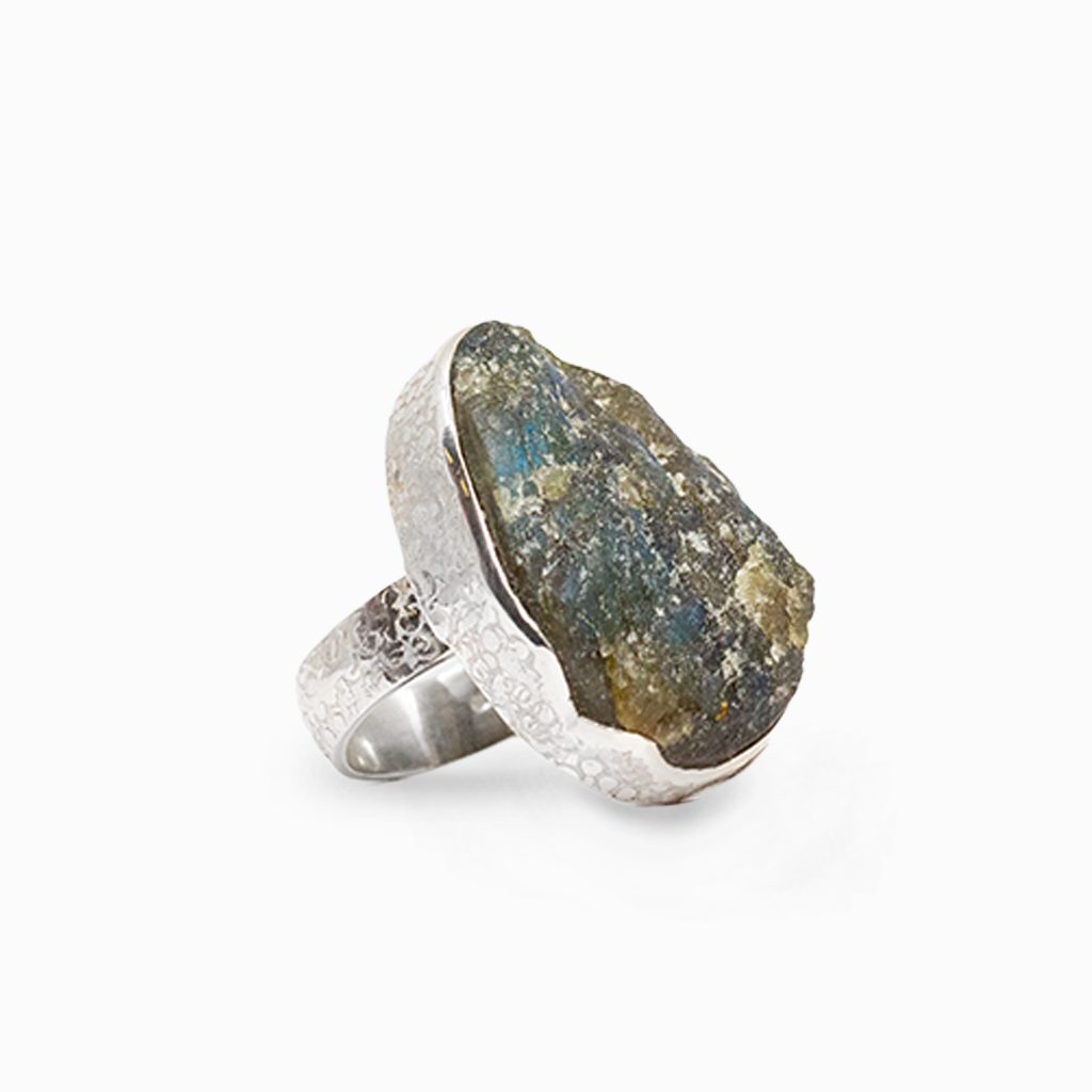 Oval Labradorite gemstone with vivid blue and green flashes framed in polished sterling silver.