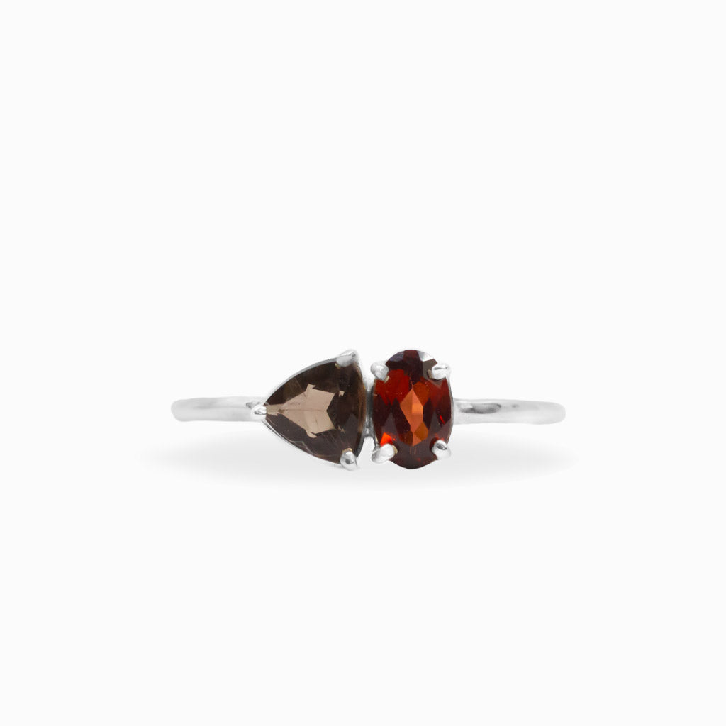 Faceted Garnet and pear-shaped Smoky Quartz two-stone ring in polished 925 sterling silver with a delicate silver band.