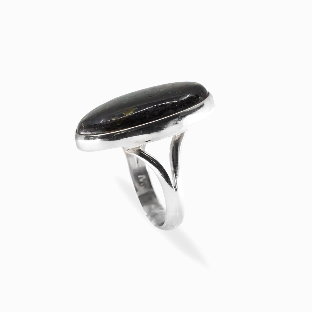Elongated oval Nuummite cabochon ring with dark tones and subtle golden flashes in polished 925 sterling silver.