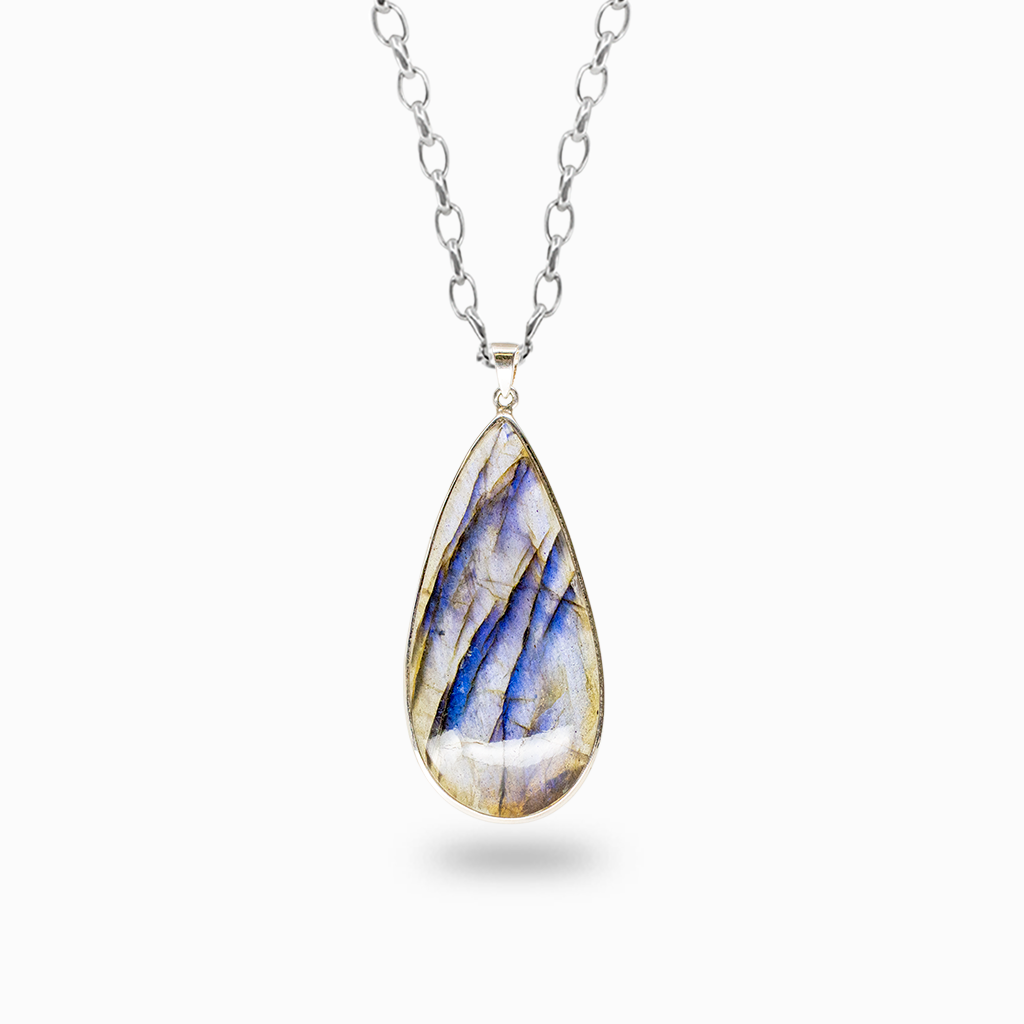 Elongated teardrop Labradorite pendant necklace displaying iridescent blue flashes and dark natural veining in a sterling silver bezel setting.