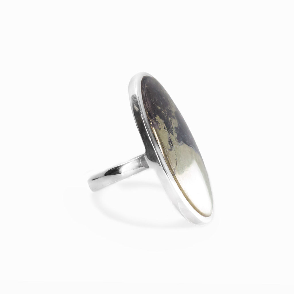 Apache Gold oval cabochon ring in polished sterling silver featuring contrasting black and naturally metallic golden mineral tones.