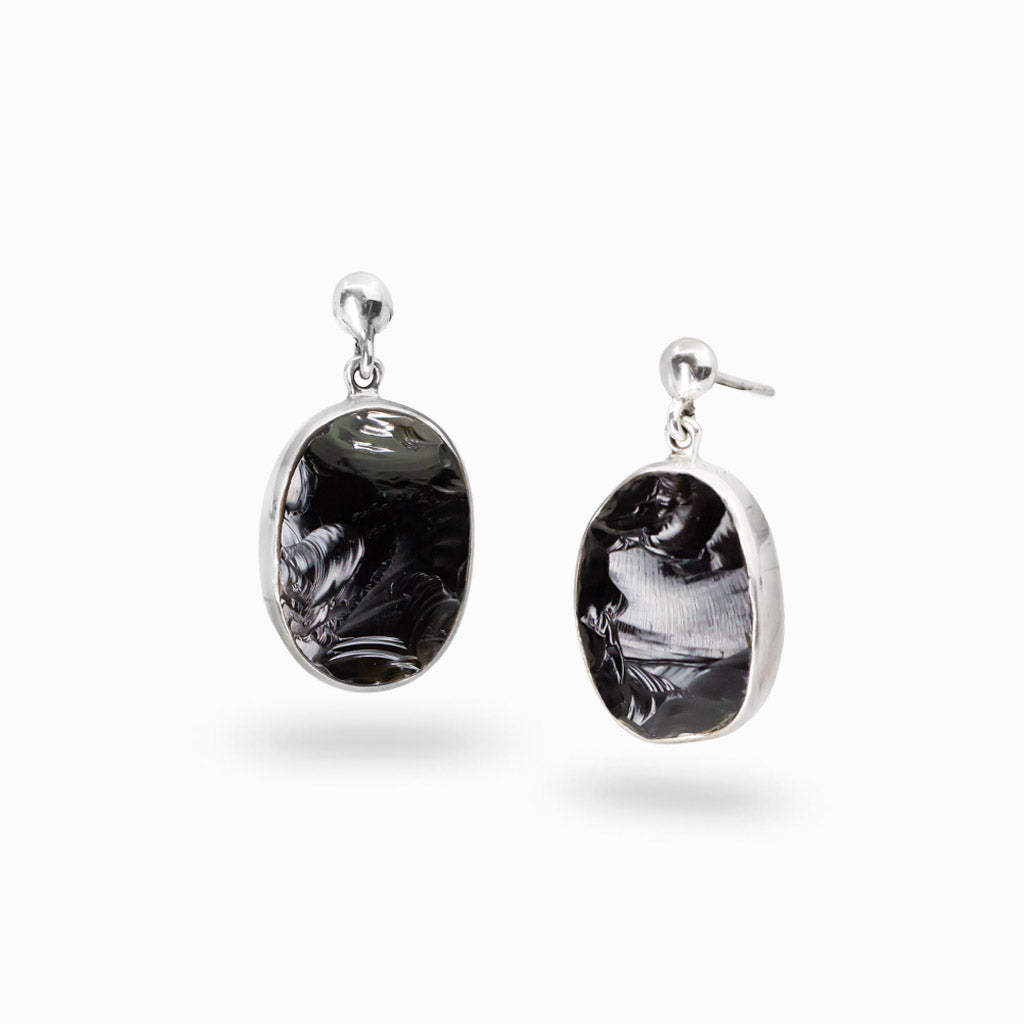 Sterling silver stud drop earrings featuring polished oval Apache Tear Obsidian gemstones.