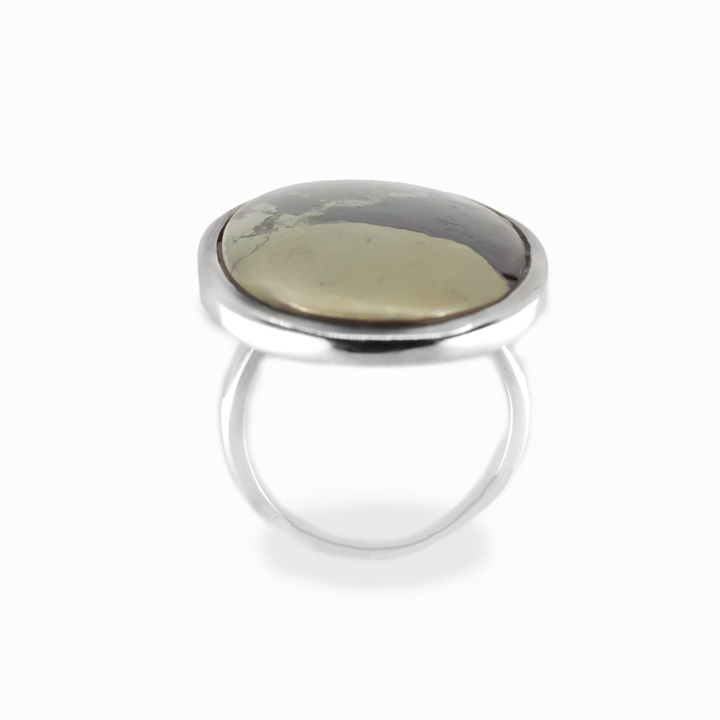 Apache Gold oval cabochon ring in polished sterling silver featuring contrasting black and naturally metallic golden mineral tones.
