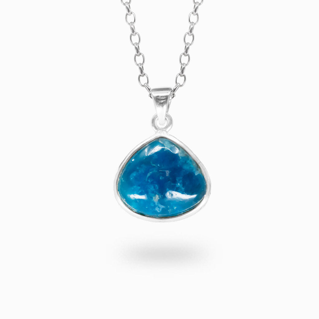 Freeform ocean-blue Apatite cabochon pendant in a polished 925 sterling silver bezel setting.