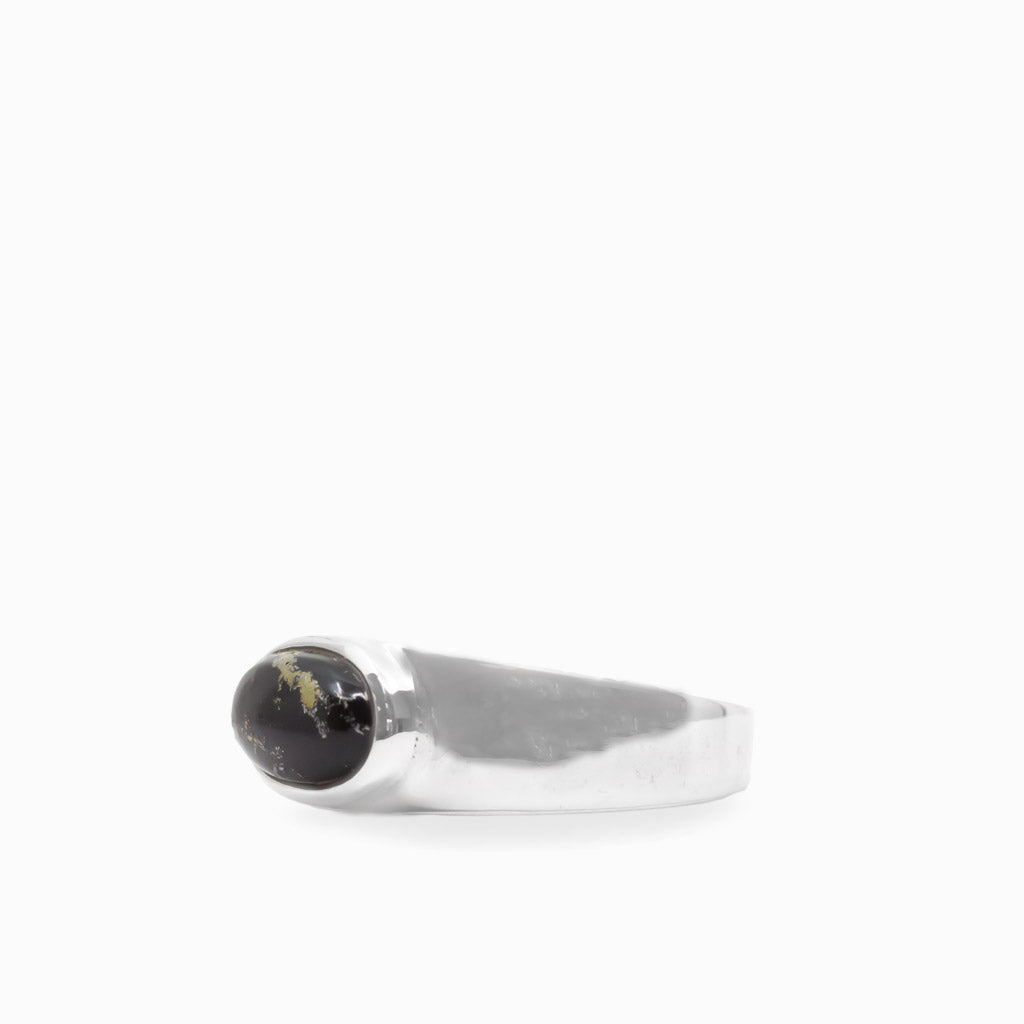 Oval black and metallic gold Apache Gold cabochon bezel set in a polished 925 sterling silver ring.