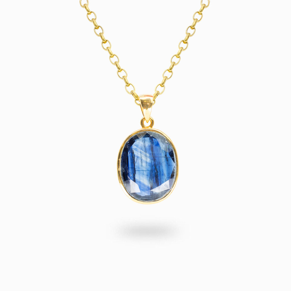 Faceted oval Kyanite pendant in polished 14K gold vermeil bezel over sterling silver.