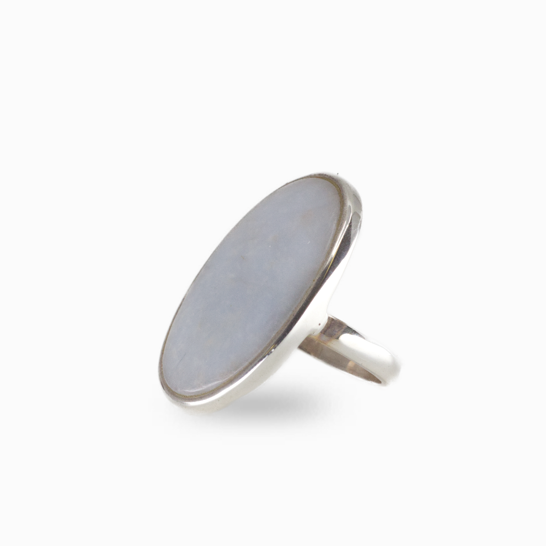Oval angelite gemstone ring with milky blue cabochon set in silver