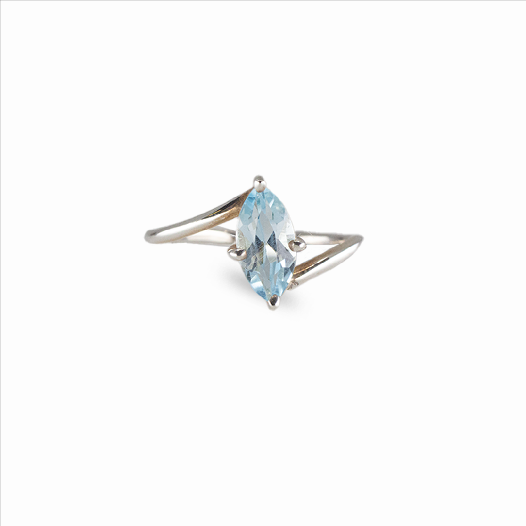 Marquise blue topaz ring with icy faceted gemstone set in sterling silver