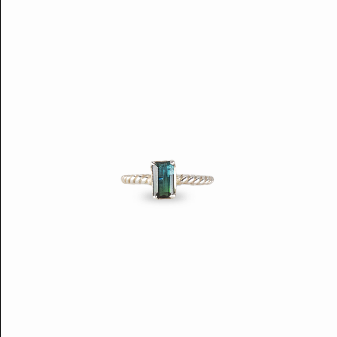 Faceted rectangle blue tourmaline ring set in sterling silver with emerald-cut gemstone