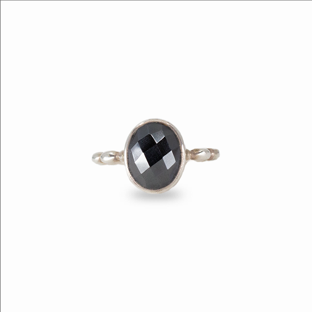 Faceted oval hematite ring with metallic black gemstone set in sterling silver