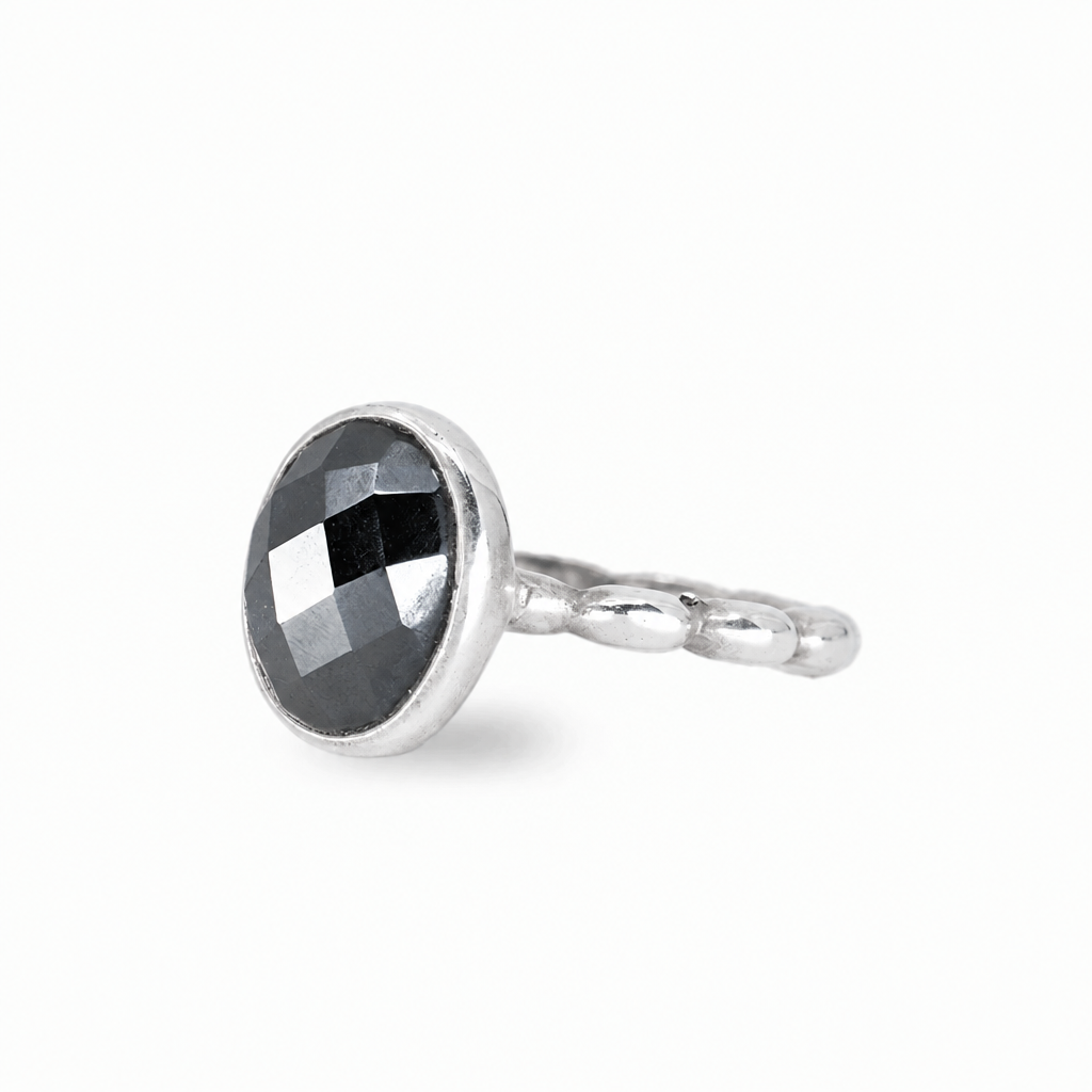 Faceted oval hematite ring with metallic black gemstone set in sterling silver