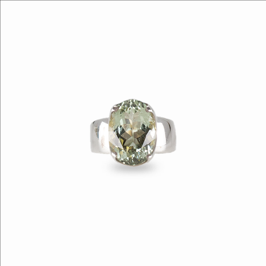 Oval mint green quartz gemstone ring set in sterling silver on white background