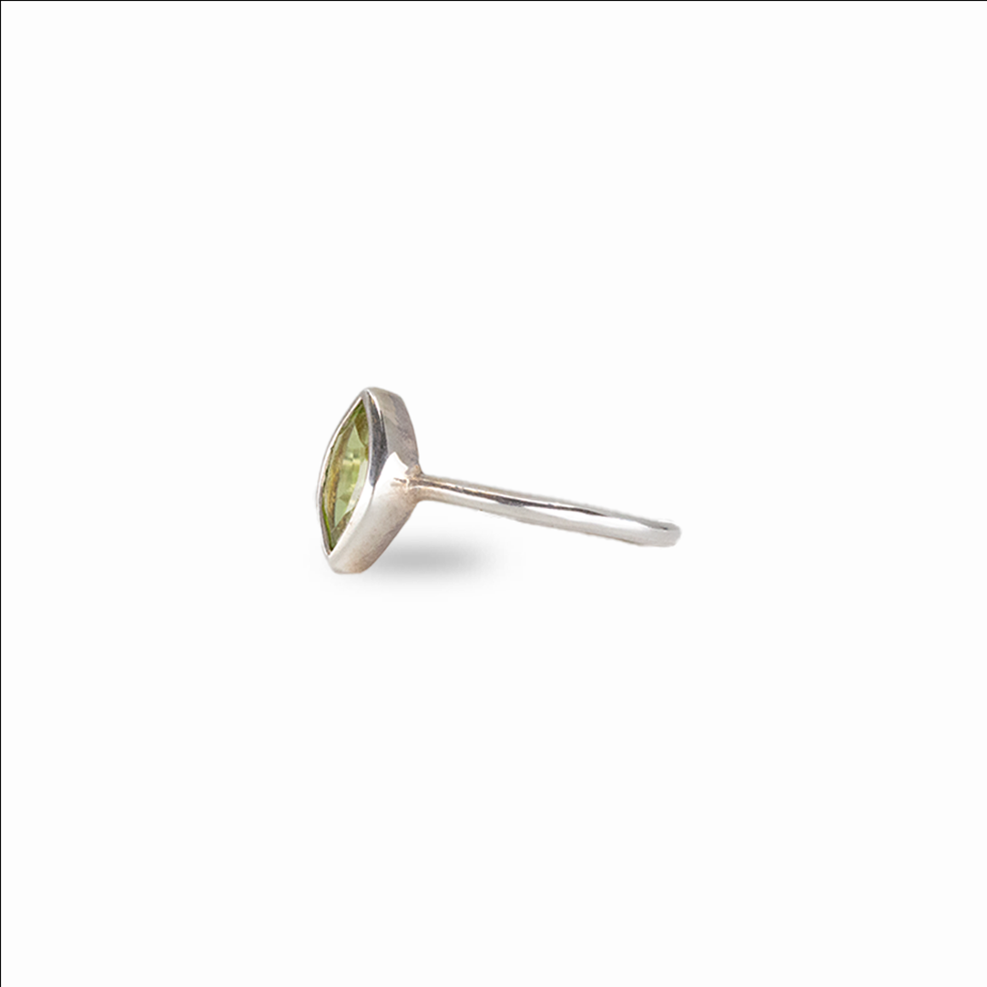 Green peridot ring set in sterling silver with minimalist design