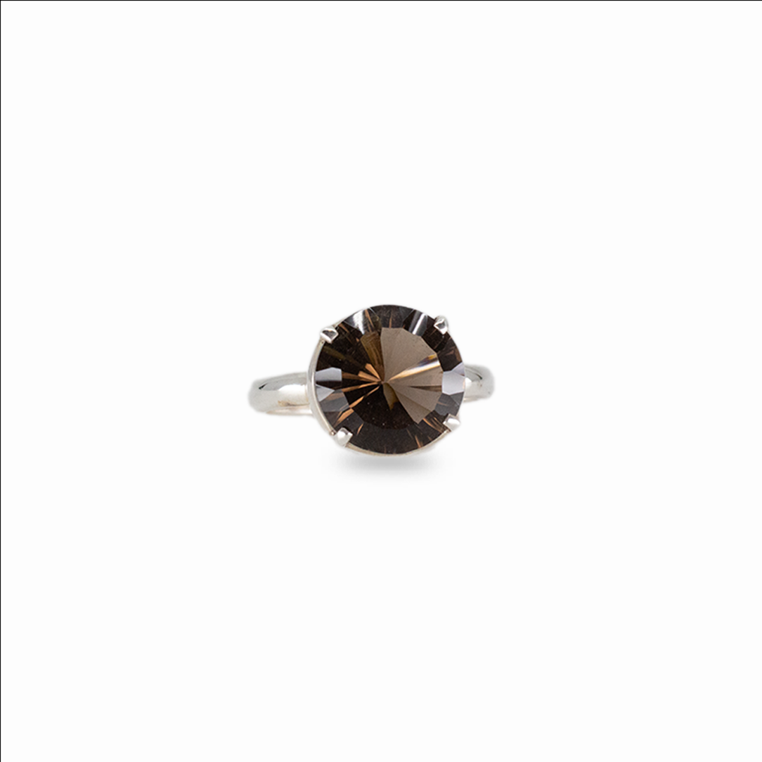 Round faceted smoky quartz gemstone ring set in sterling silver on white background