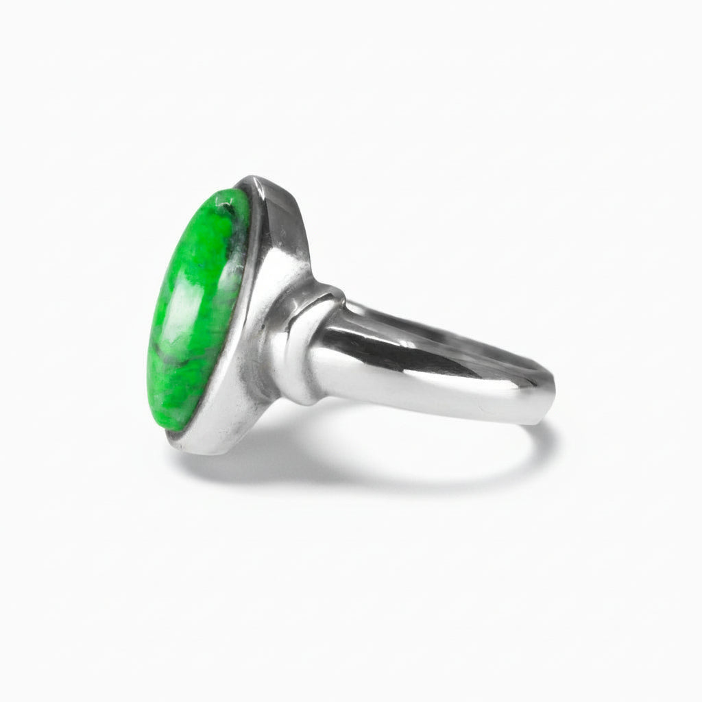 marquise-shaped Maw Sit Sit Jade ring with vivid grassy-green tones set in a polished sterling silver band on a white background. | MADE IN EARTH