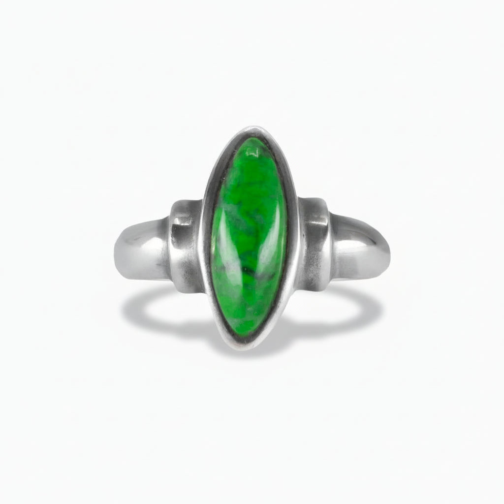 marquise-shaped Maw Sit Sit Jade ring with vivid grassy-green tones set in a polished sterling silver band on a white background. | MADE IN EARTH