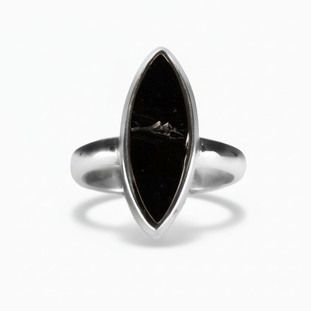 Marquise-cut polished Shungite ring in sterling silver with deep black glossy finish and natural mineral texture on a white background. | MADE IN EARTH