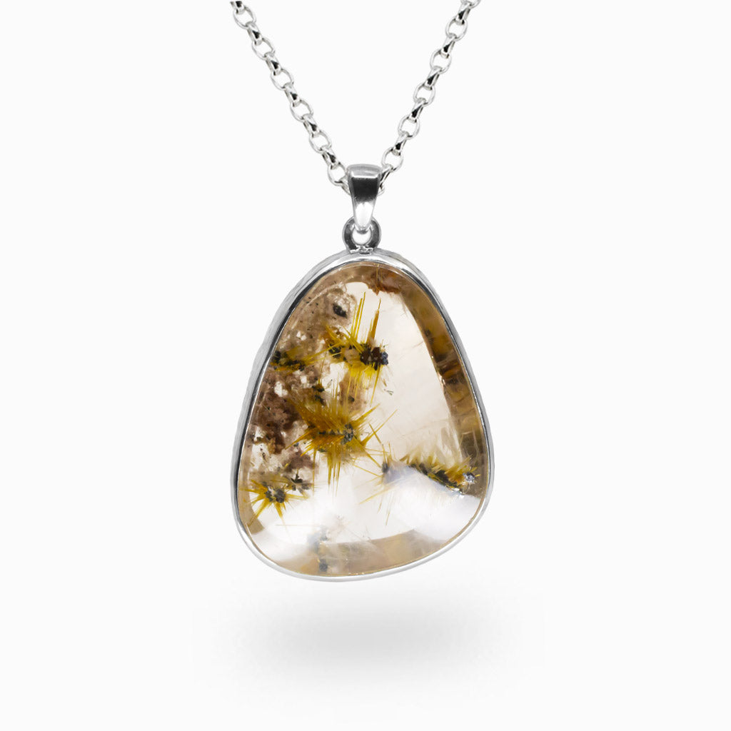 Teardrop rutilated quartz pendant with golden rutile needles and grey hematite inclusions, set in sterling silver on a chain.