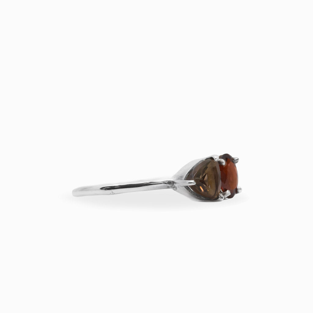 Faceted Garnet and pear-shaped Smoky Quartz two-stone ring in polished 925 sterling silver with a delicate silver band.