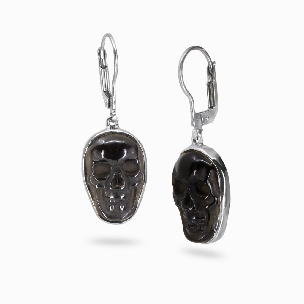 Black Obsidian skull drop earrings set in sterling silver with polished dark gemstone carving.| MADE IN EARTH