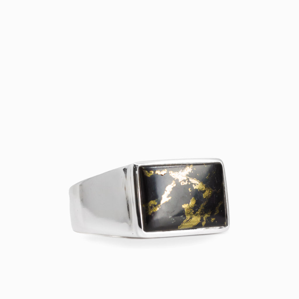 Rectangular black and metallic gold Apache Gold cabochon set in a polished 925 sterling silver ring.