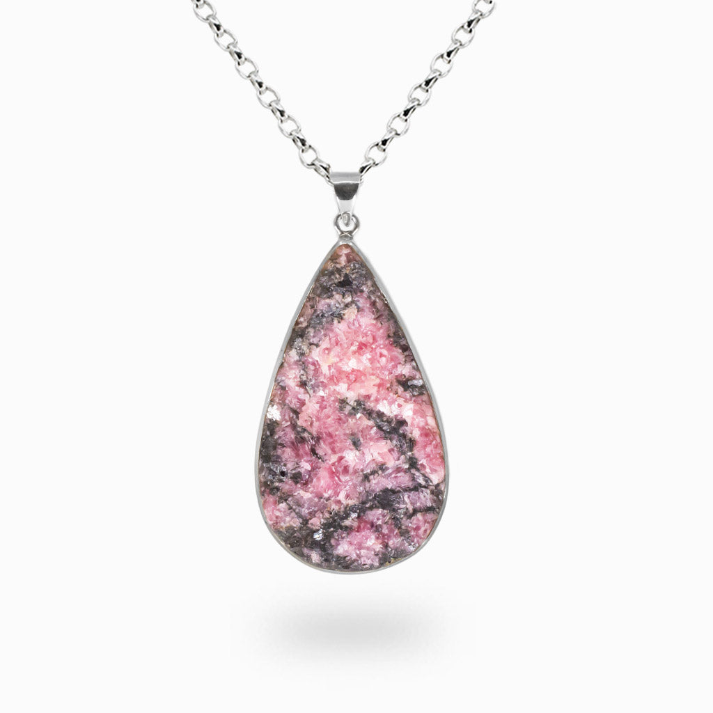 Raw pink Rhodonite teardrop necklace with black dendritic patterns set in sterling silver. | MADE IN EARTH