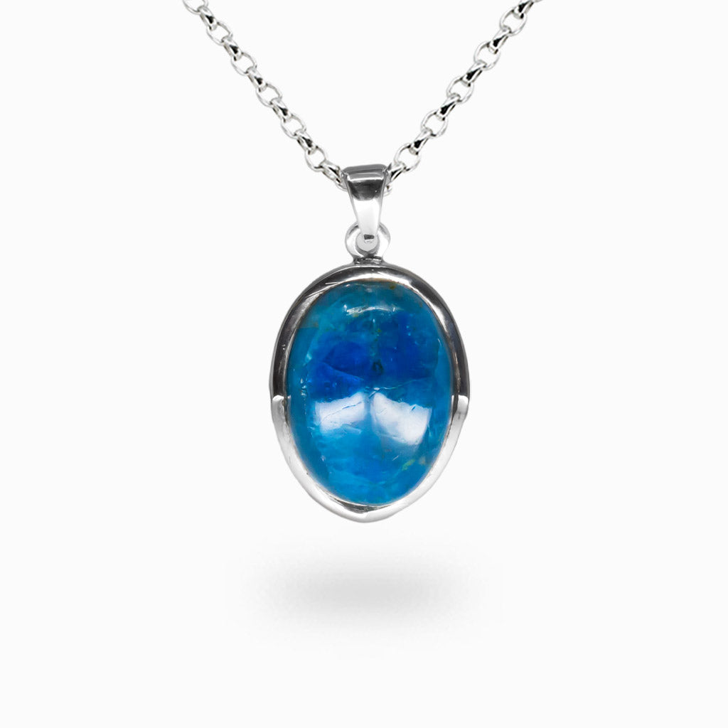 Oval cabochon Apatite necklace set in sterling silver with vivid blue gemstone and natural crystal structure