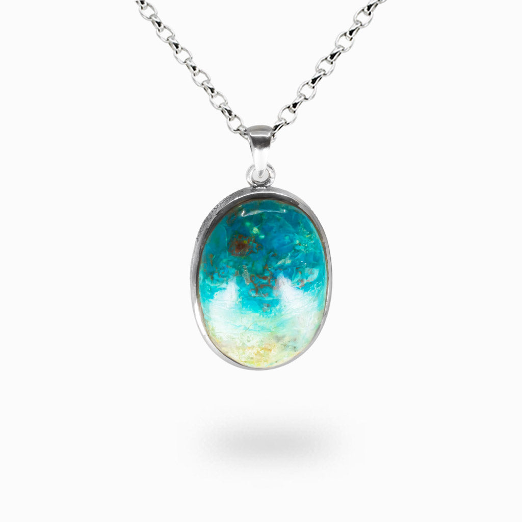 Oval Eilat Chrysocolla pendant necklace with blue-green and copper marbling, polished cabochon set in sterling silver bezel on silver chain. | MADE IN EARTH