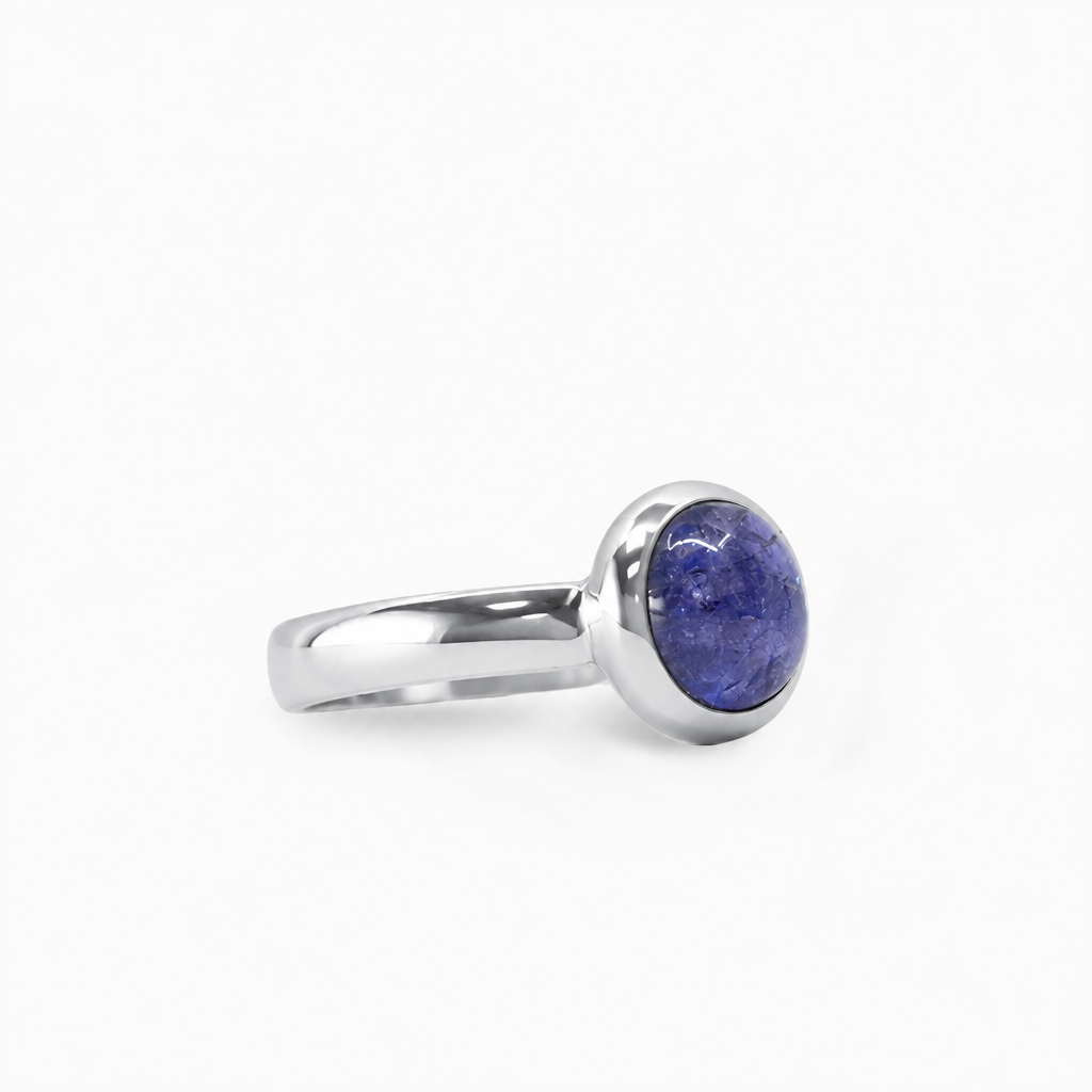 Round violet-blue Tanzanite cabochon ring in polished 925 sterling silver with a smooth bezel setting and classic band.