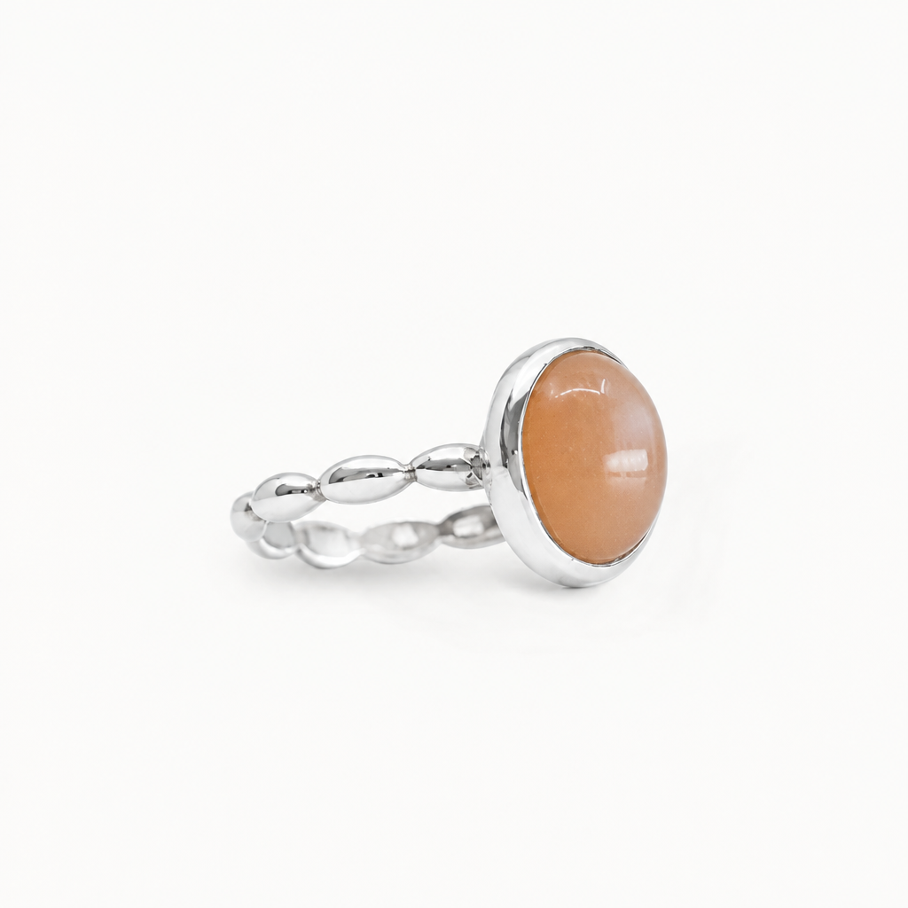 Oval Peach Moonstone cabochon ring set in polished 925 sterling silver.