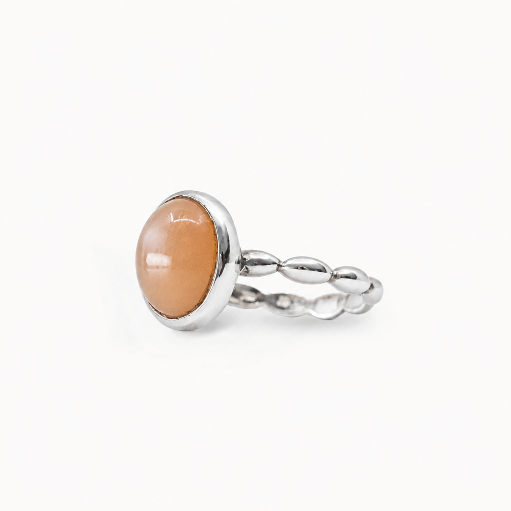 Oval Peach Moonstone cabochon ring set in polished 925 sterling silver.