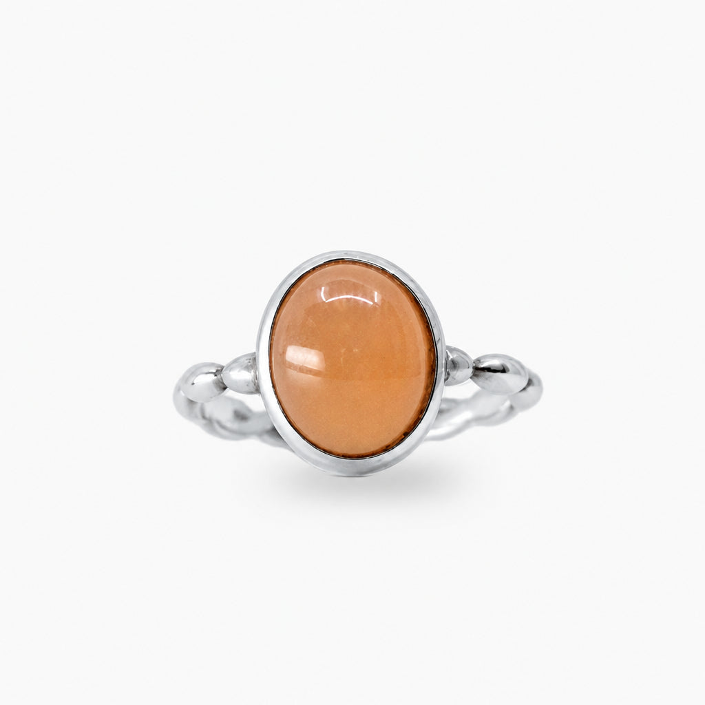 Oval Peach Moonstone cabochon ring set in polished 925 sterling silver.