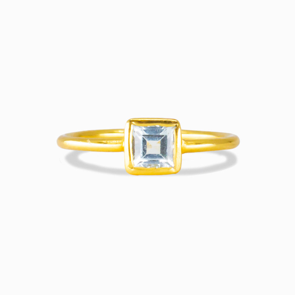 Square-cut blue topaz ring in gold vermeil with a minimalist bezel setting. | MADE IN EARTH