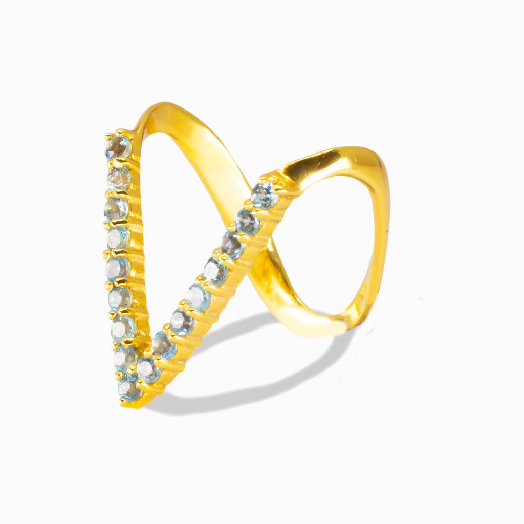 Dazzling Blue Topaz V-Shaped gold vermeil ring. A radiant gemstone of love, success, confidence, and manifestation. Modern chevron design with brilliant sparkle.  MADE IN EARTH