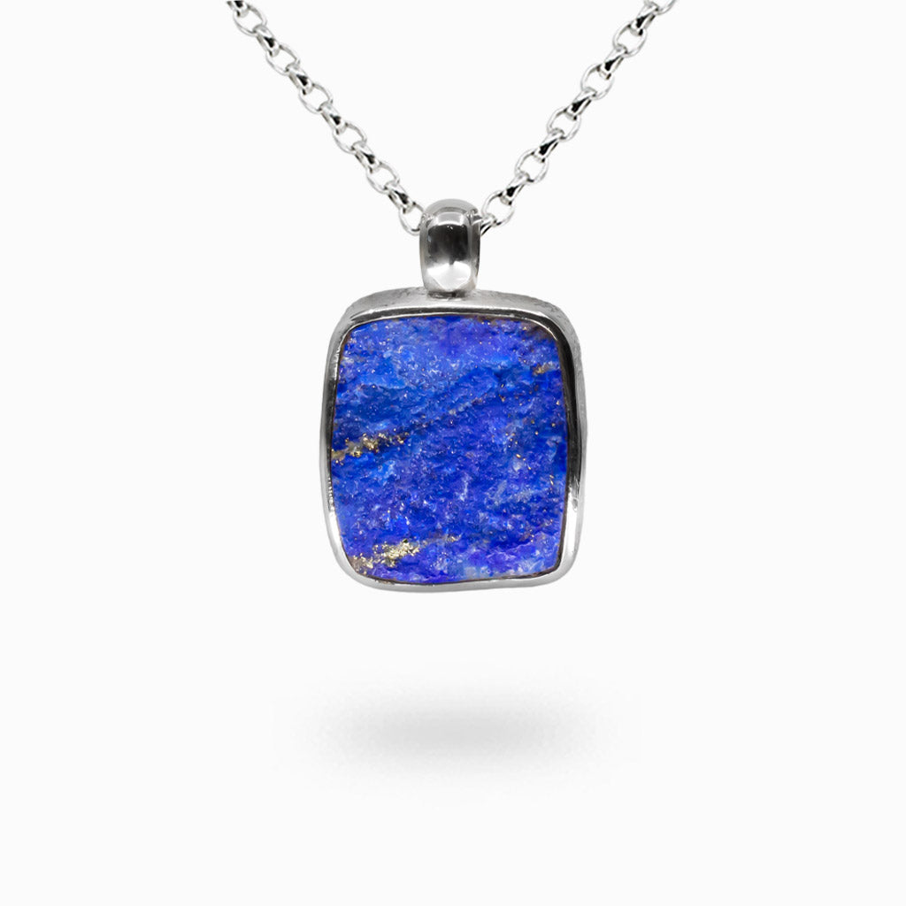 Raw lapis lazuli necklace in sterling silver bezel, deep blue stone with natural pyrite inclusions. | MADE IN EARTH