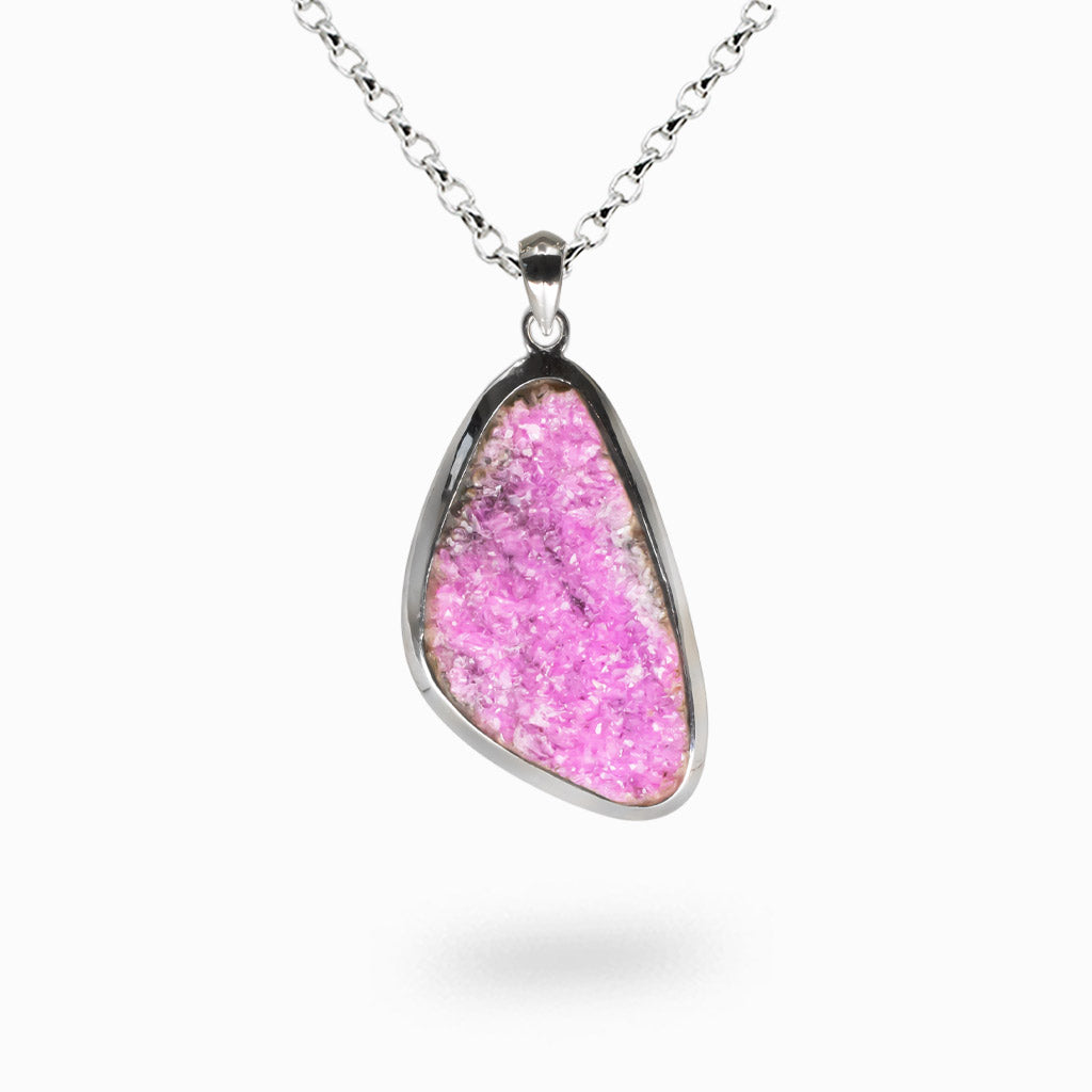 Raw cobaltian calcite druzy pendant with bright pink crystals set in sterling silver. | MADE IN EARTH