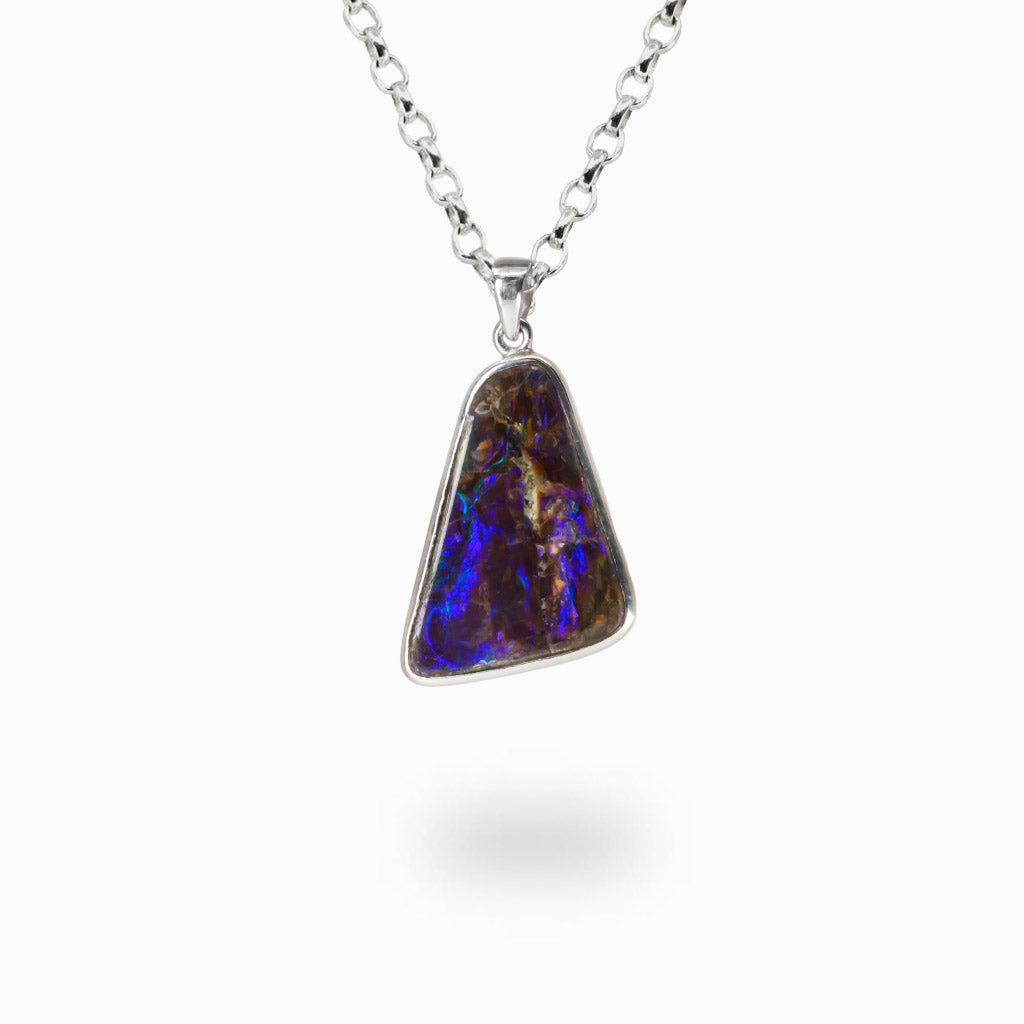 Natural Ammolite pendant necklace with iridescent colors set in sterling silver bezel