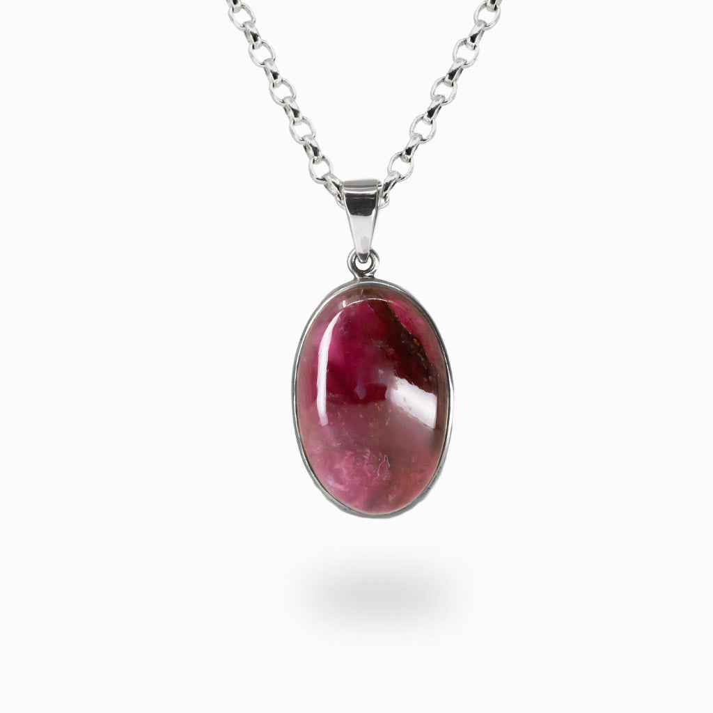 Large oval Pink Tourmaline cabochon necklace set in sterling silver bezel with vibrant pink gemstone pendant. MADE IN EARTH