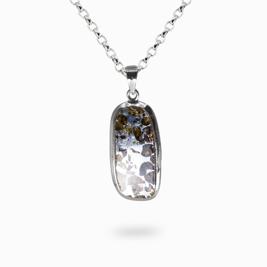 Pallasite meteorite necklace with Peridot crystals in rectangular sterling silver bezel setting. MADE IN EARTH