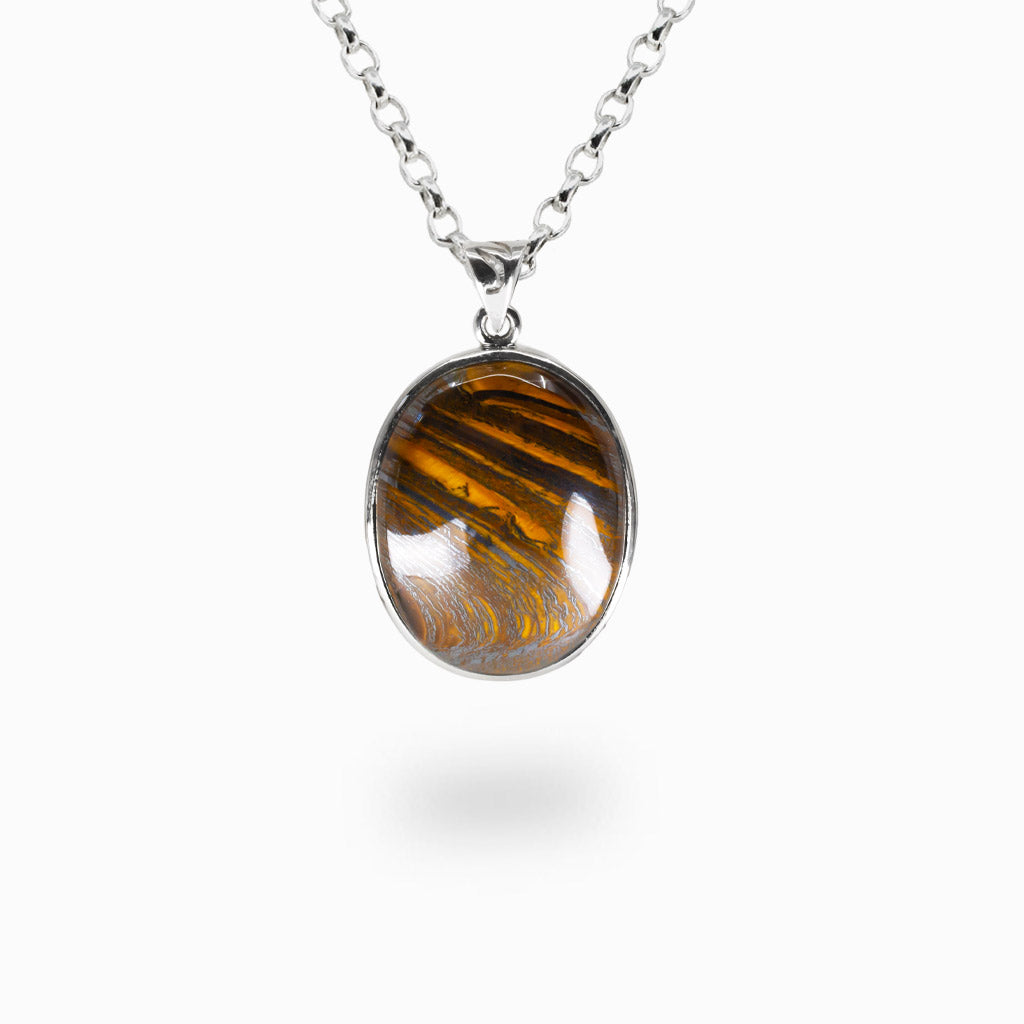 Tiger iron oval cabochon necklace in sterling silver bezel with golden, red, and brown banded patterns from tiger eye, jasper, and hematite.| MADE IN EARTH