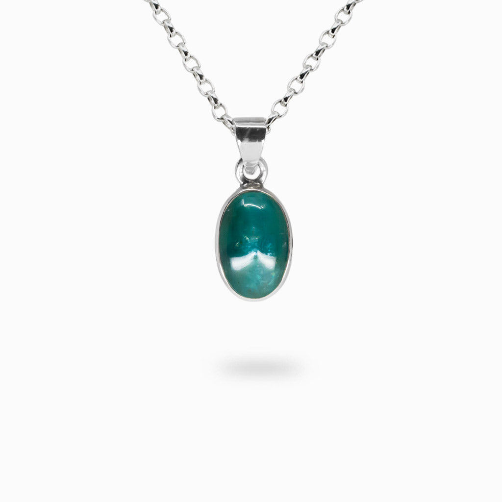 Oval blue-green Cat’s Eye Apatite cabochon pendant set in polished 925 sterling silver on a silver chain.