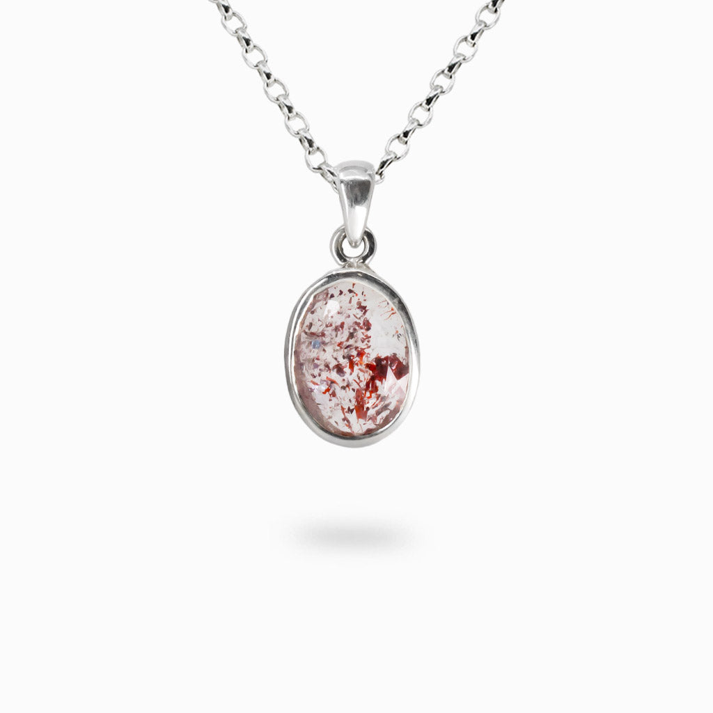 Faceted oval lepidocrocite quartz necklace with red inclusions in sterling silver bezel pendant