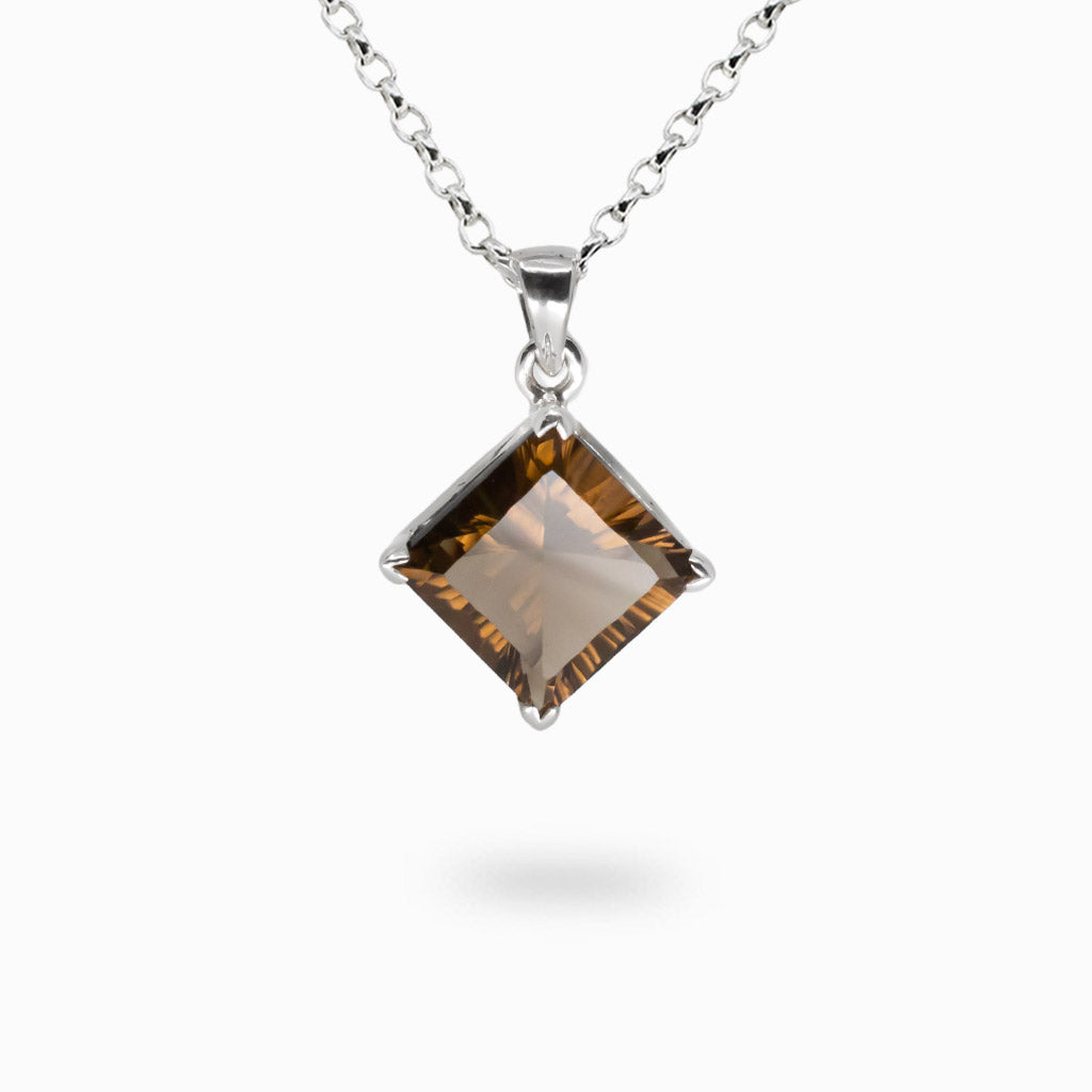 Faceted diamond-shaped Smoky Quartz necklace set in sterling silver with transparent brown crystal | MADE IN EARTH