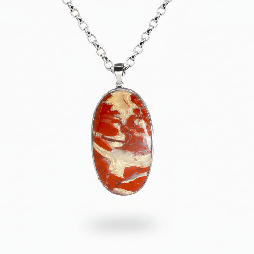 Oval red jasper cabochon pendant in sterling silver setting