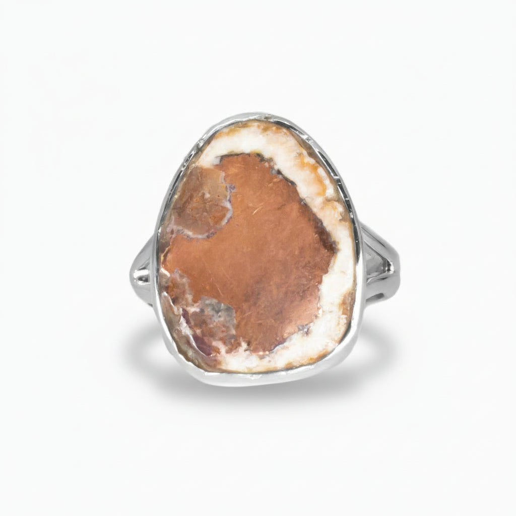 Cabochon oval Native Copper ring set in sterling silver with earthy reddish tones and metallic textures on a white background | MADE IN EARTH