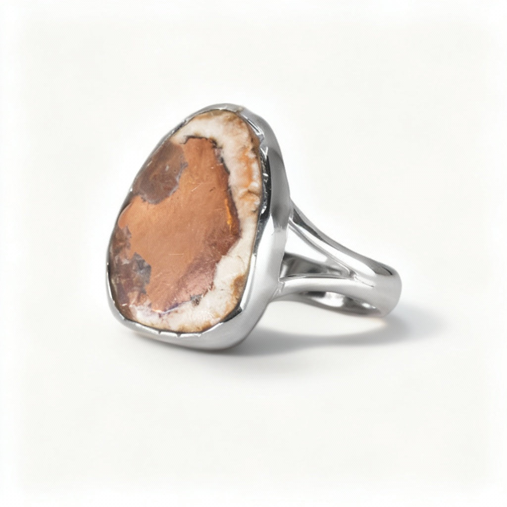 Cabochon oval Native Copper ring set in sterling silver with earthy reddish tones and metallic textures on a white background | MADE IN EARTH