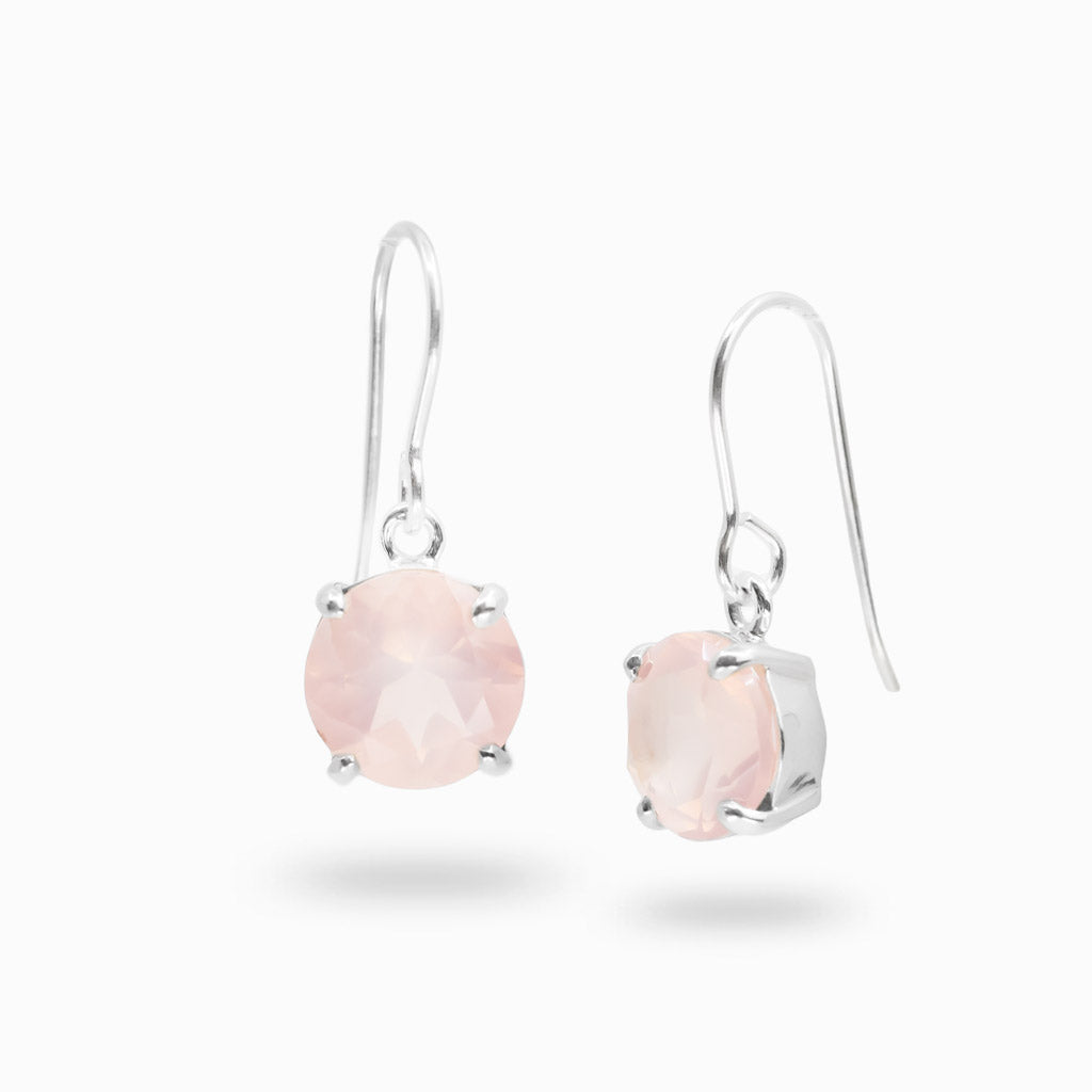 Sterling silver drop earrings featuring faceted round Rose Quartz gemstones.