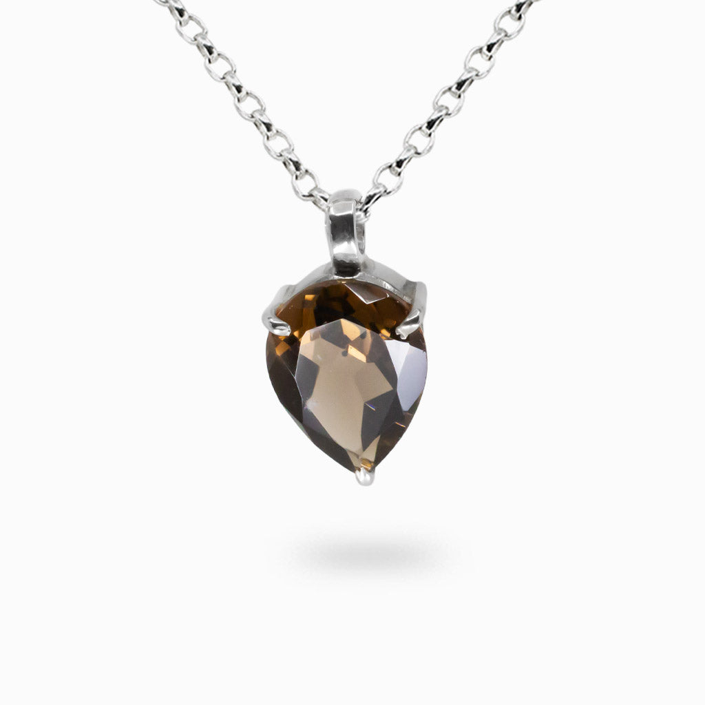 Faceted tear-shaped smokey quartz gemstone pendant set in sterling silver bezel.