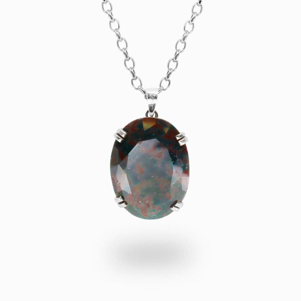 Faceted oval Bloodstone pendant necklace in sterling silver featuring natural deep green gemstone with red inclusions.
